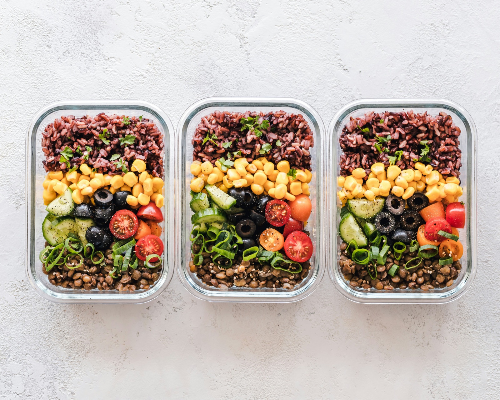 Fresh, colorful healthy meal-prep bowls with grains and vegetables
